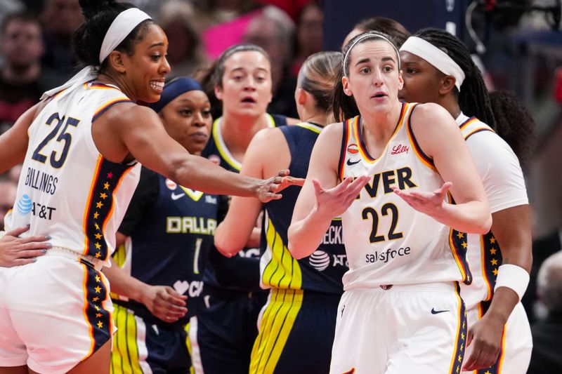Indiana Fever guard Caitlin Clark (22) talks with an official Thursday, April 30, 2026, during the first half of a preseason game between the Indiana Fever and the Dallas Wings at Gainbridge Fieldhouse in Indianapolis.