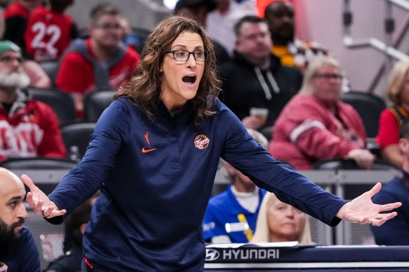 Indiana Fever head coach Stephanie White calls out to her team Thursday, April 30, 2026, during the first half of a preseason game between the Indiana Fever and the Dallas Wings at Gainbridge Fieldhouse in Indianapolis.
