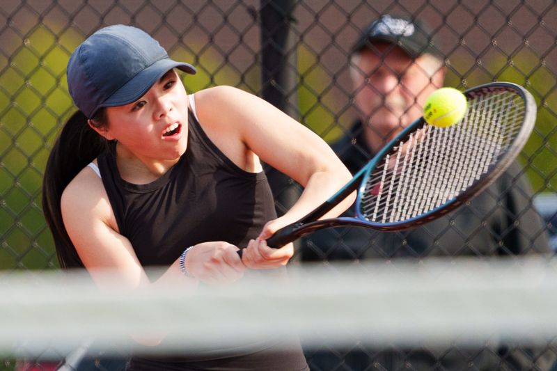 Penn's Olivia Wu hits the ball during a girls tennis match between Penn and Saint Joseph at Penn High School on Thursday, April 30, 2026, in Mishawaka.