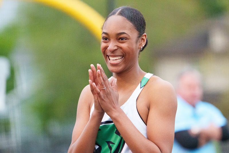 Washington's Adriana Swanson celebrates after winning the girls 100 meter hurdles during the South Bend City Track & Field meet at Saint Joseph High School on Thursday, April 30, 2026, in South Bend.