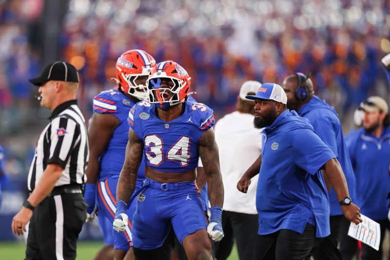 Nov 1, 2025; Jacksonville, Florida, USA; Florida Gators edge rusher George Gumbs Jr. (34) celebrates a play in the second half against the Georgia Bulldogs at EverBank Stadium. Mandatory Credit: Matt Pendleton-Imagn Images
