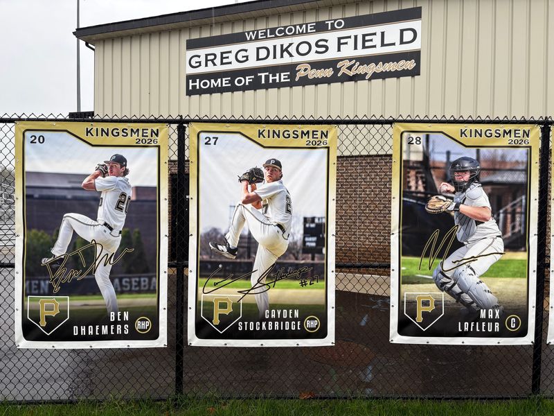 A line of Penn baseball senior banners hang along the fence outside of Greg Dikos Field in Mishawaka Monday, April 27.