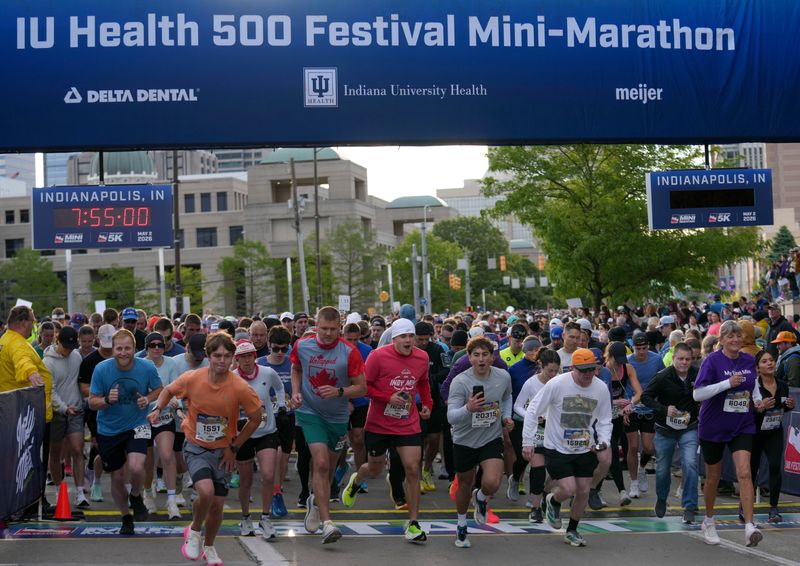 Participants take off from the starting line during the 2026 500 Festival Mini-Marathon Saturday, May 2, 2026, in downtown Indianapolis.