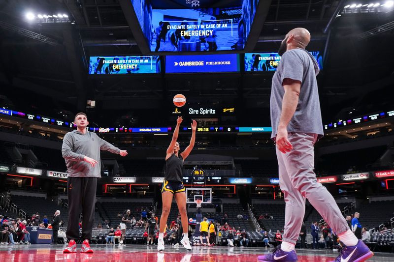 Indiana Fever forward Monique Billings (25) warms up Saturday, May 2, 2026, during the first half of a preseason game at Gainbridge Fieldhouse in Indianapolis.