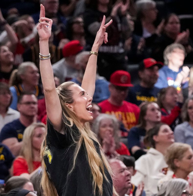 Indiana Fever guard Lexie Hull (10) celebrates from the bench Saturday, May 2, 2026, during the first half of a preseason game at Gainbridge Fieldhouse in Indianapolis.