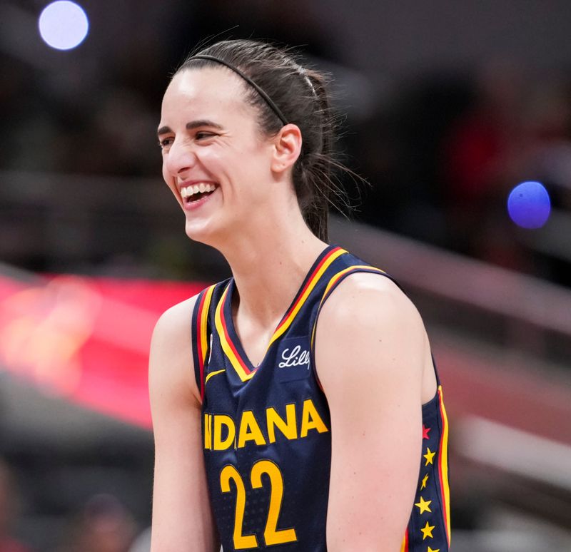 Indiana Fever guard Caitlin Clark (22) smiles Saturday, May 2, 2026, during the first half of a preseason game at Gainbridge Fieldhouse in Indianapolis.