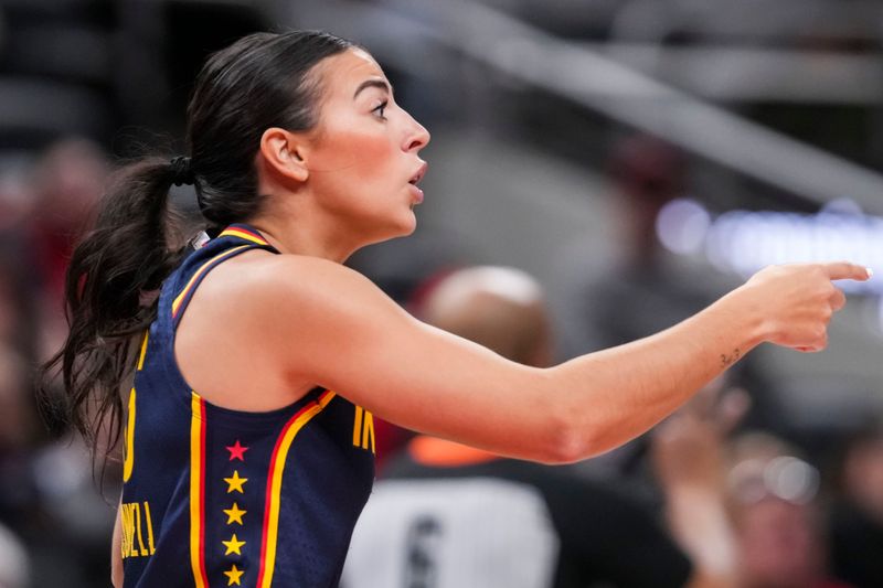 Indiana Fever guard Megan McConnell (16) points to a teammate Saturday, May 2, 2026, during the second half of a preseason game at Gainbridge Fieldhouse in Indianapolis. The Indiana Fever defeated Nigeria, 105-57.