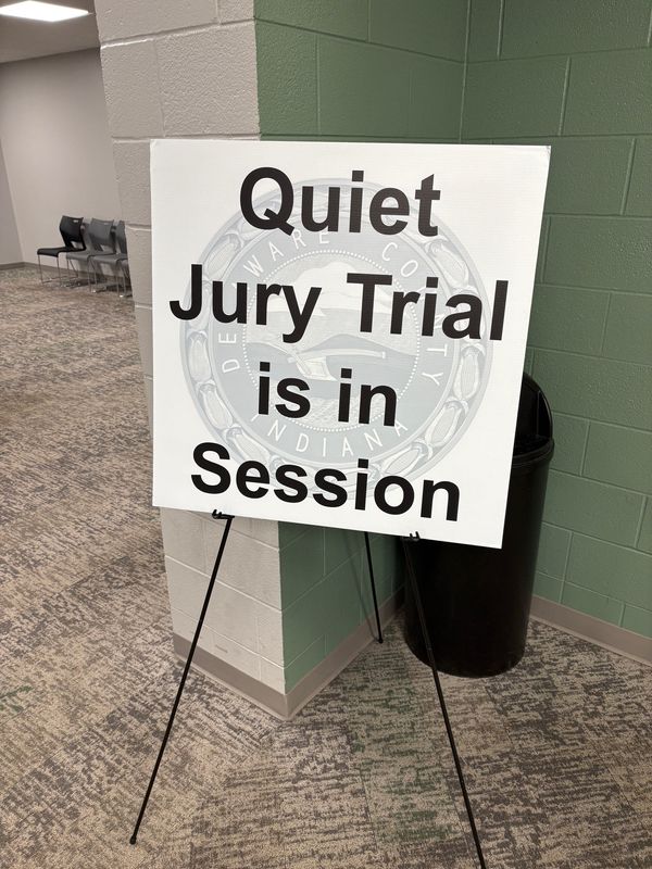 A sign placed outside courtrooms in the Delaware County Justice Center when jury trials are underway.