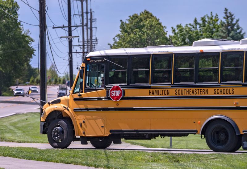 A Hamilton Southeastern Schools bus leaves the transportation services area on Cumberland Road, Monday, May 4, 2026 in Fishers.