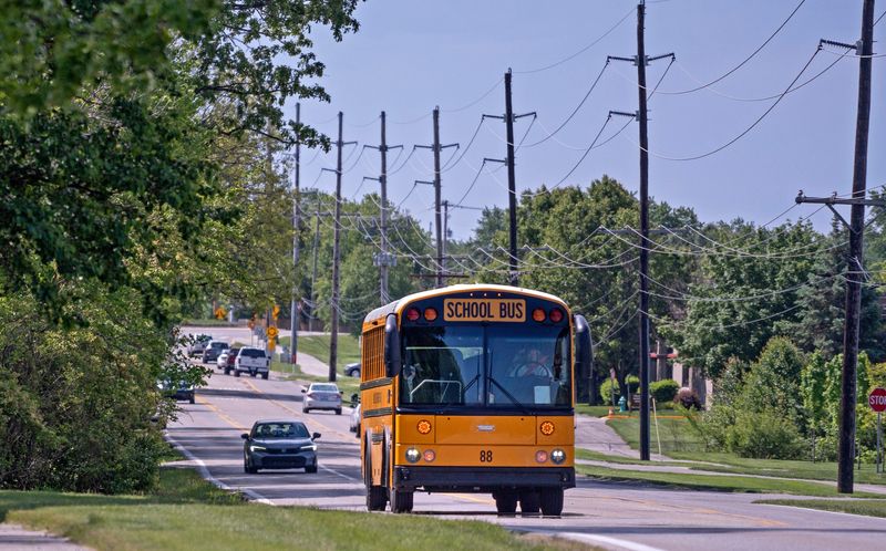 A Hamilton Southeastern Schools bus travels on Cumberland Road, Monday, May 4, 2026 in Fishers.