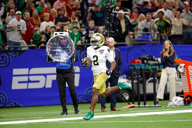 Jan 2, 2025; New Orleans, LA, USA; Notre Dame Fighting Irish wide receiver Jayden Harrison (2) celebrates after scoring a touchdown during the second half against Georgia Bulldogs at Caesars Superdome. Mandatory Credit: Amber Searls-Imagn Images