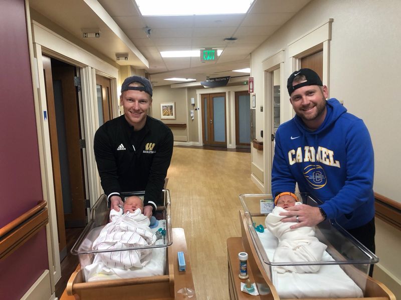 Garrett Winegar (left) and J.R. Howell with their sons, Guyton Winegar and Jack Howell, at Ascension St. Vincent Hospital in Carmel in April of 2020.