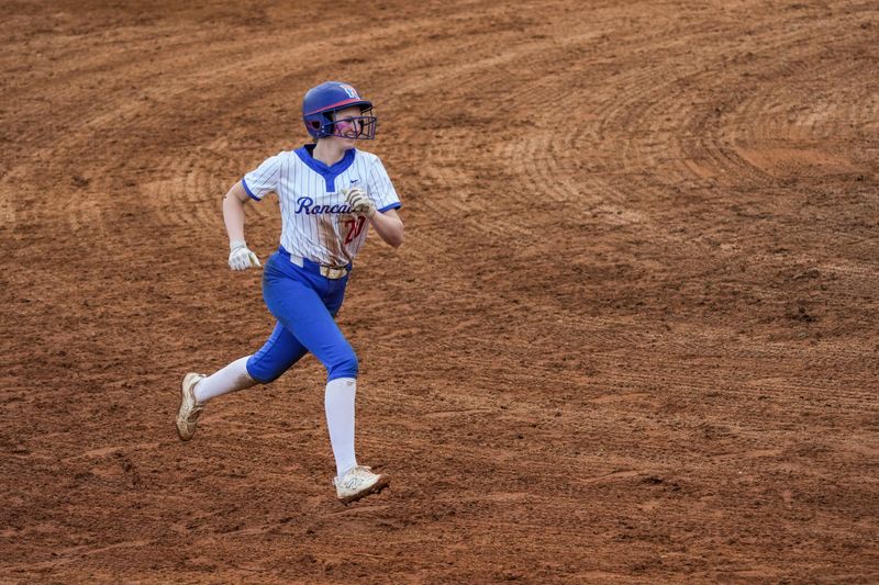 Roncalli Royals Jazlyn Lawson (20) runs the bases after a home run Wednesday, May 6, 2026, during a softball game at Roncalli High School in Indianapolis. The Roncalli Royals defeated the New Palestine Dragons, 6-3.