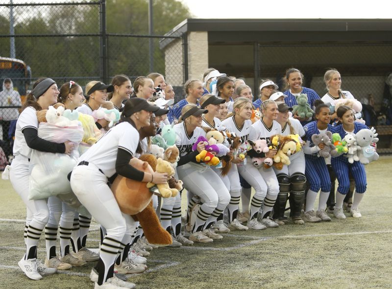 Penn and Elkhart softball combined for a "teddy bear toss" ahead of their game Thursday, May 7, 2026, with the bears being donated to Beacon Children's Hospital.