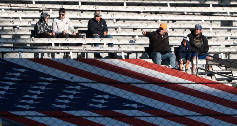 Fans watch from the Paddock area Friday, May 8, 2026, during practice for the Sonsio Grand Prix at Indianapolis Motor Speedway.