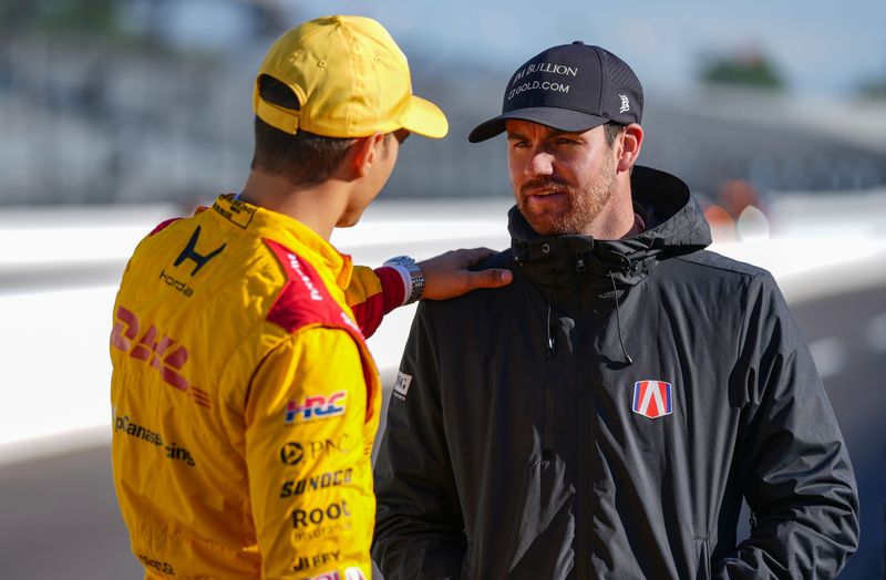Andretti Global driver Kyle Kirkwood (27) talks to Chip Ganassi Racing driver Alex Palou (10) on Friday, May 8, 2026, during practice for the Sonsio Grand Prix at Indianapolis Motor Speedway.