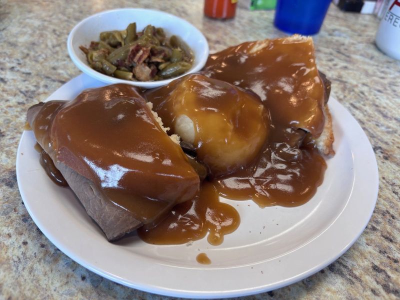 The beef Manhattan, a roast beef sandwich with mashed potatoes smothered in gravy, is among the offerings at Charlie Brown's Pancake and Steak House, 1038 N. Main St., Speedway. May 3, 2026