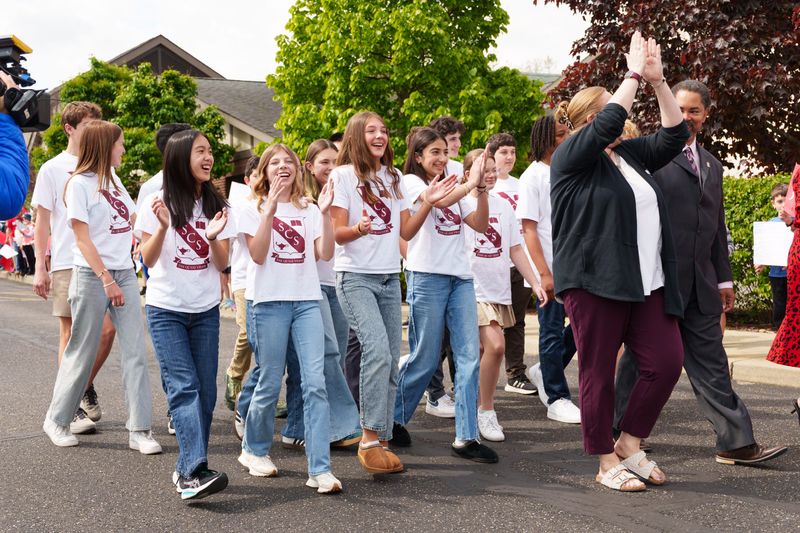 Stanley Clark School's middle school Science Olympiad team parades by students cheering them on Friday, May 8, 2026, in South Bend. The team will represent Indiana at the National Science Olympiad Tournament at the University of Southern California on May 22-23.