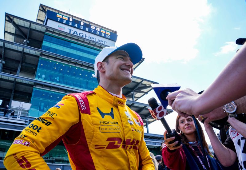Chip Ganassi Racing driver Alex Palou (10) celebrates pole position Saturday, May 9, 2026, after qualifying for the Sonsio Grand Prix at Indianapolis Motor Speedway.