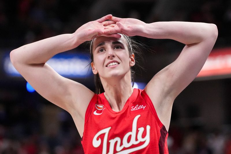 Indiana Fever guard Caitlin Clark (22) reacts Saturday, May 9, 2026, after losing the Fever’s season opener game at Gainbridge Fieldhouse in Indianapolis. The Dallas Wings defeated the Indiana Fever, 107-104.