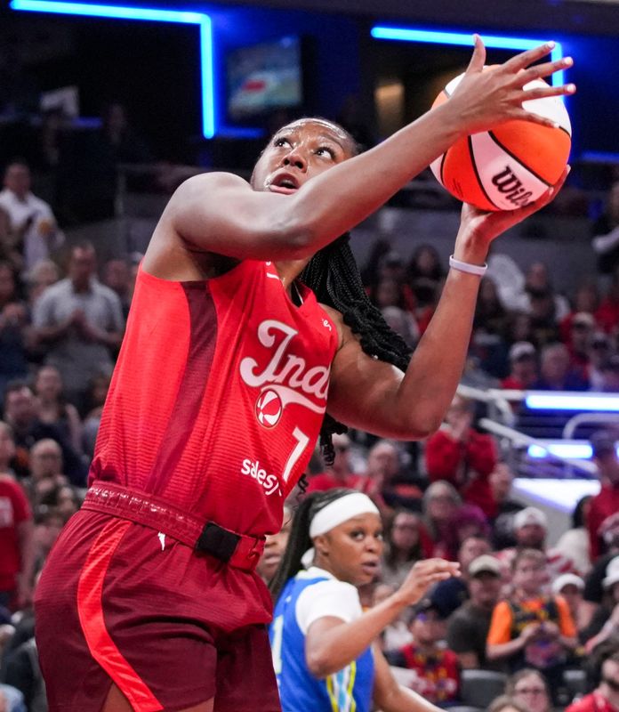 Indiana Fever center-forward Aliyah Boston (7) goes up for a basket Saturday, May 9, 2026, during the second half of the Fever’s season opener game at Gainbridge Fieldhouse in Indianapolis. The Dallas Wings defeated the Indiana Fever, 107-104.