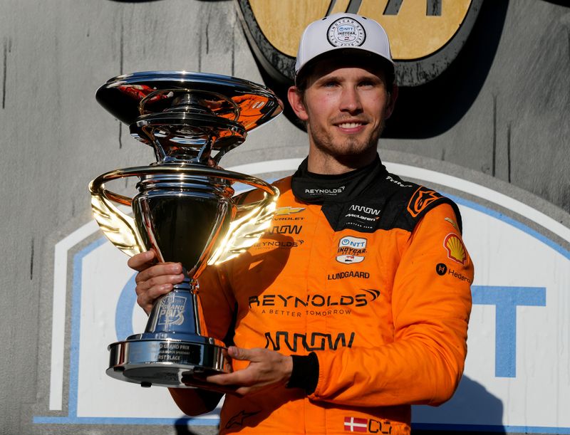 Arrow McLaren driver Christian Lundgaard (7) poses for a photo Saturday, May 9, 2026, after winning the Sonsio Grand Prix at Indianapolis Motor Speedway.