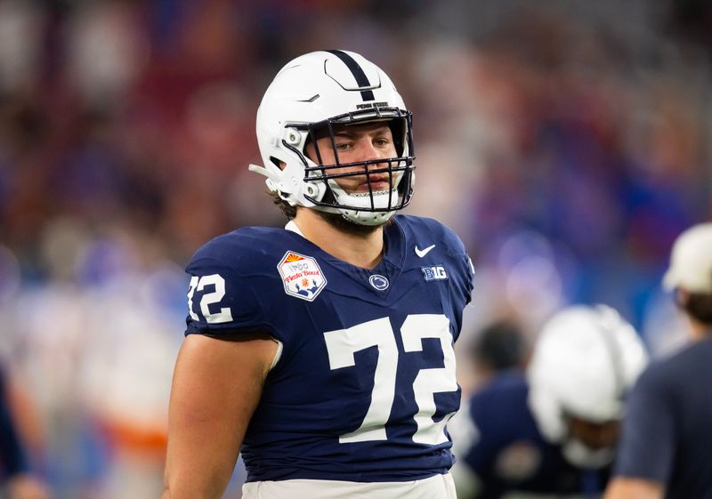 Dec 31, 2024; Glendale, AZ, USA; Penn State Nittany Lions offensive lineman Nolan Rucci (72) against the Boise State Broncos during the Fiesta Bowl at State Farm Stadium. Mandatory Credit: Mark J. Rebilas-Imagn Images