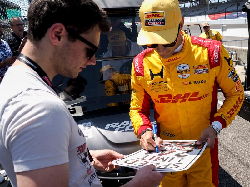 Chip Ganassi Racing driver Alex Palou (10) signs autographs Tuesday, May 12, 2026, during practice for the 110th running of the Indianapolis 500 at Indianapolis Motor Speedway.