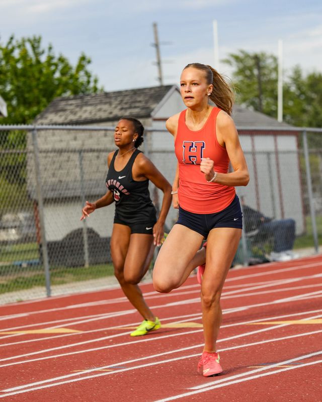 Harrison sprinter Tenley Blankenship strides out in front of the competition in the girls 200m dash at the "Lafayette City County 4 Way" meet on May 12, 2026, at the West Lafayette Athletic Complex in West Lafayette, IN.