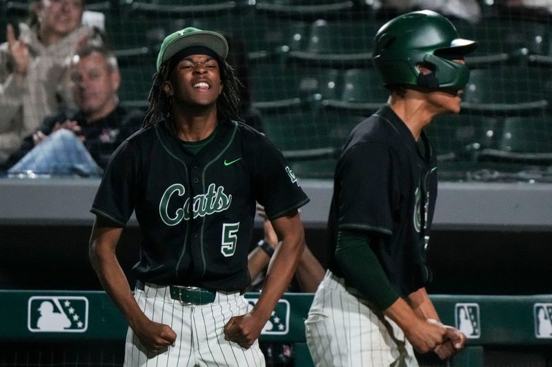 Lawrence North Wildcats Quentin Harper (5) celebrates Tuesday, May 12, 2026, during the County Tournament Championship at Victory Field in Indianapolis. The Decatur Central Hawks defeated the Lawrence North Wildcats, 8-3.