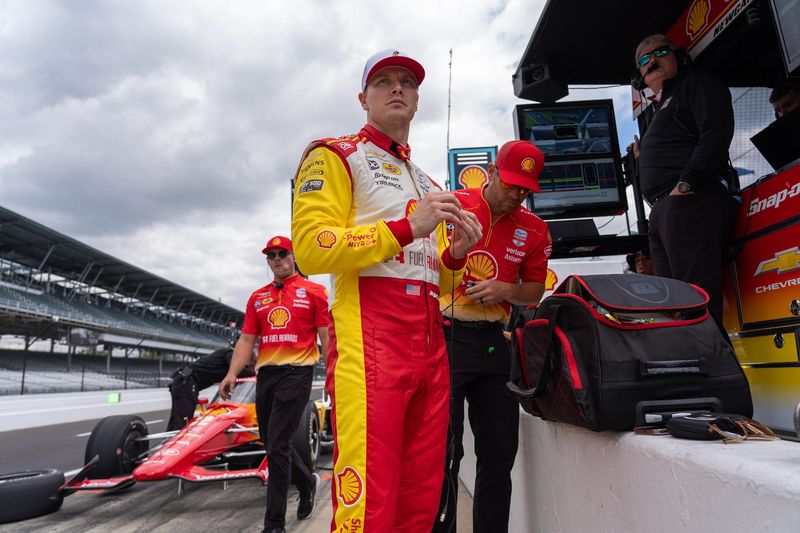 Team Penske driver Josef Newgarden (2) puts in ear protection Wednesday, May 13, 2026, during practice for the 110th running of the Indianapolis 500 at Indianapolis Motor Speedway.