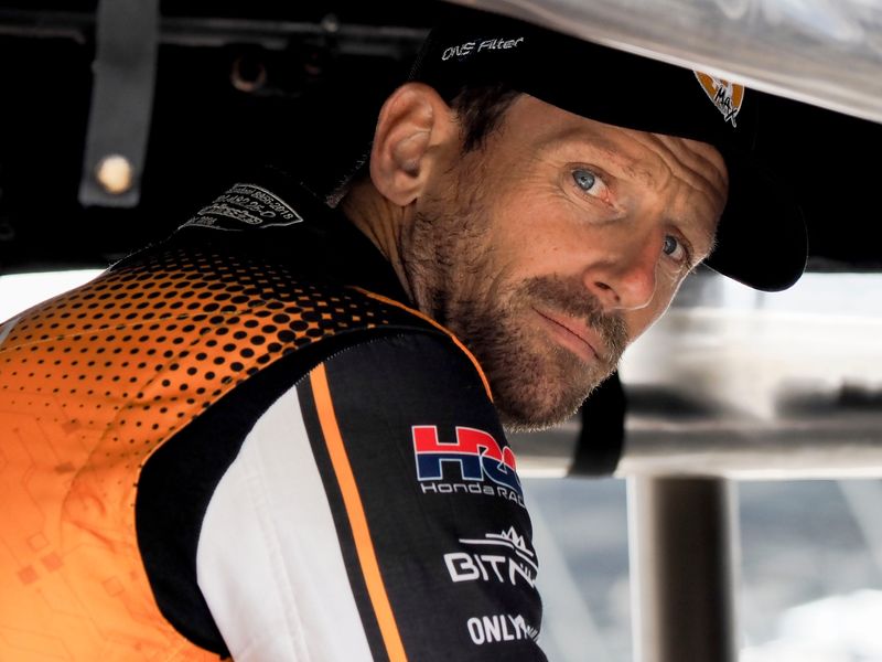 Dale Coyne Racing driver Romain Grosjean (18) looks out from his pit box Wednesday, May 13, 2026, during practice for the 110th running of the Indianapolis 500 at Indianapolis Motor Speedway.
