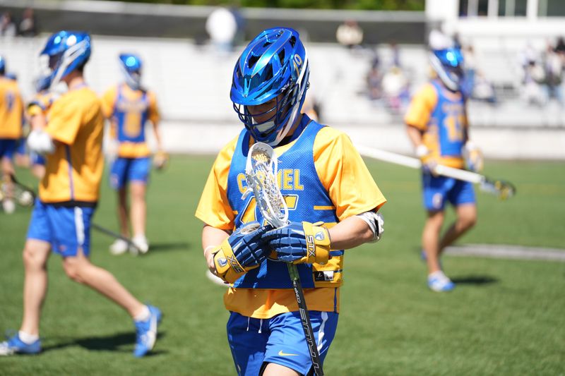 Carmel boys lacrosse player Mikey Recktenwall has played 12 games through a torn ACL this season.