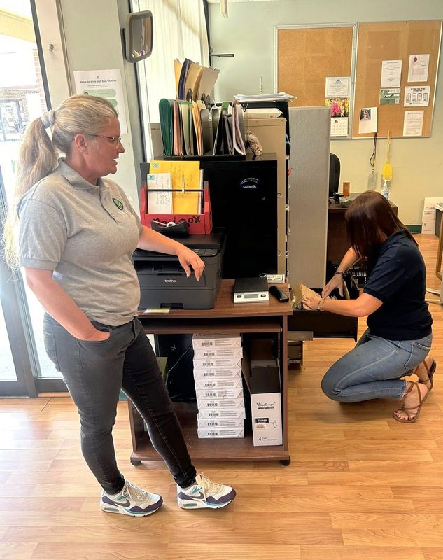 Misty James, left, assistant director at New Leaf New Life, watches as Heather Bland, executive director of New Leaf New Life, searches through files at the office.