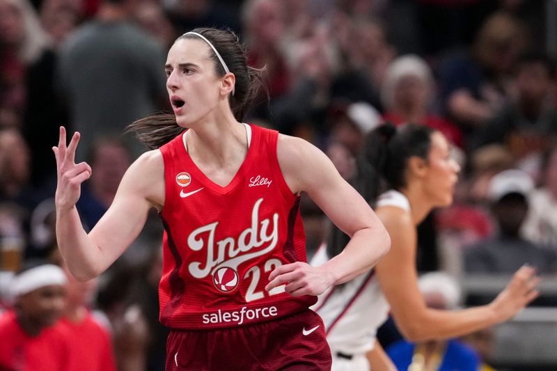Indiana Fever guard Caitlin Clark (22) celebrates a 3-pointer Friday, May 15, 2026, during the first half of a game at Gainbridge Fieldhouse in Indianapolis.