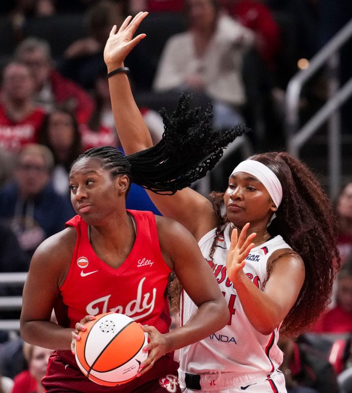 Indiana Fever forward Aliyah Boston (7) looks to pass against Washington Mystics forward Kiki Iriafen (44) on Friday, May 15, 2026, during the first half of a game at Gainbridge Fieldhouse in Indianapolis.