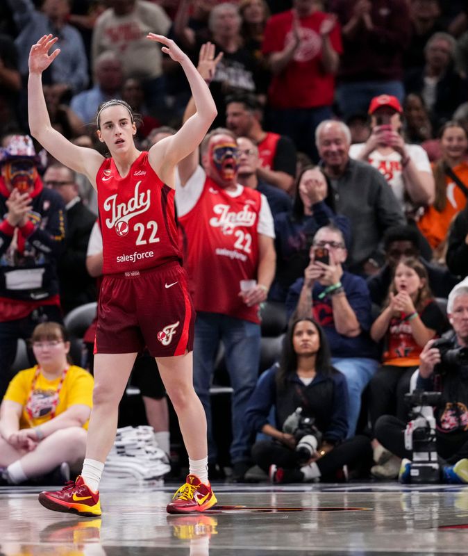 Indiana Fever guard Caitlin Clark (22) celebrates a 3-pointer Friday, May 15, 2026, during the second half of a game at Gainbridge Fieldhouse in Indianapolis. The Washington Mystics defeated the Indiana Fever in overtime, 104-102.