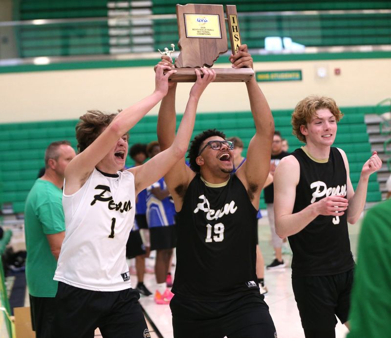 Penn freshman Caio Neto (left), senior Christian Bonner (middle) and junior Kelan Whitehouse (right) celebrate winning an IHSAA boys volleyball sectional championship Saturday, May 16, 2026, at Northridge High School.