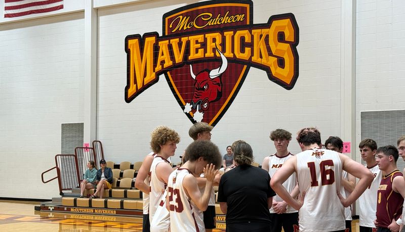 Members of McCutcheon's boys volleyball team discuss strategy between sets in a sectional championship match against Zionsville at Resler Gymnasium in Lafayette on May 16, 2026.