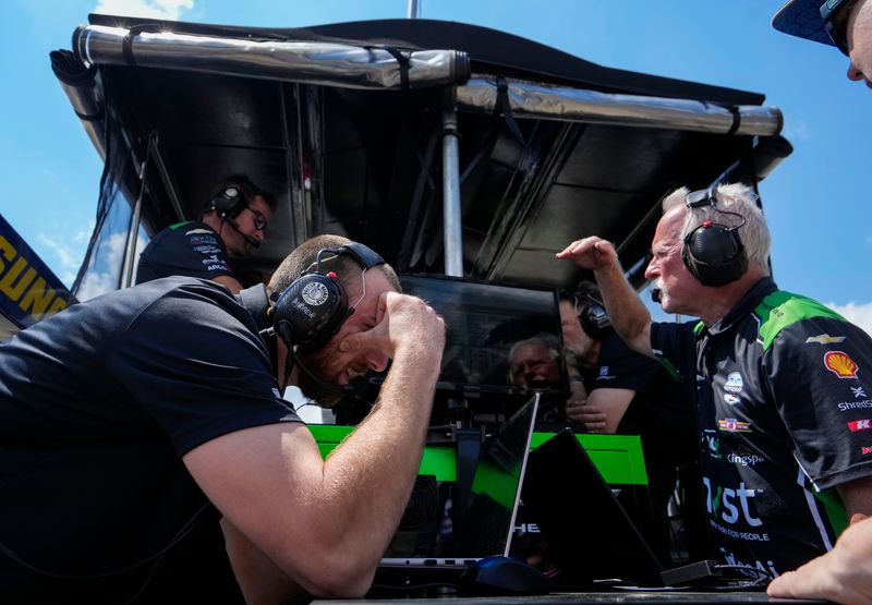 Dreyer and Reinbold Racing driver Jack Harvey (24) pit crew members watches qualifying on Sunday, May 17, 2026, during qualifying for the 110th running of the Indianapolis 500 at Indianapolis Motor Speedway.