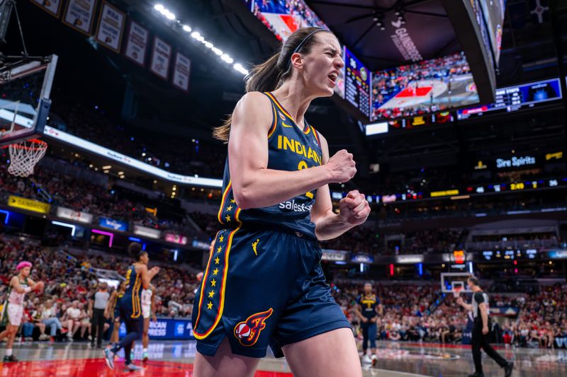 Indiana Fever guard Caitlin Clark (22) reacts after being fouled on a play while scoring during the first half of an WNBA basketball game against the Seattle Storm, Sunday, May 17, 2026, at Gainbridge Fieldhouse.