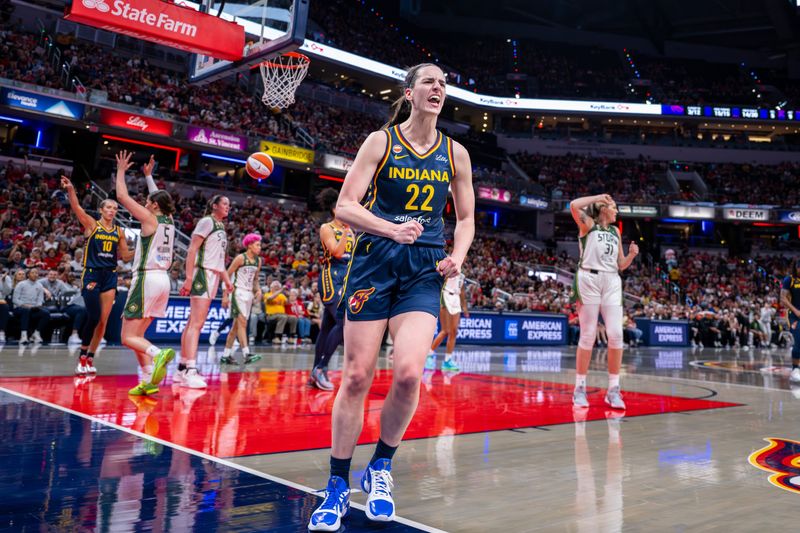 Indiana Fever guard Caitlin Clark (22) reacts after being fouled on a play while scoring during the first half of an WNBA basketball game against the Seattle Storm, Sunday, May 17, 2026, at Gainbridge Fieldhouse.