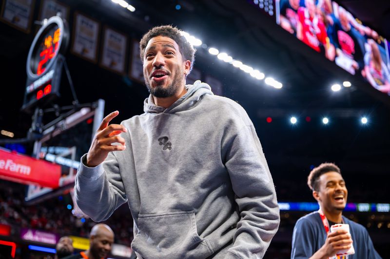 Indiana Pacers point guard Tyrese Haliburton reacts after using a t-shirt canon to shoot souvenirs into the stands during the second half of an WNBA basketball game, between the Indiana Fever and the Seattle Storm Sunday, May 17, 2026, at Gainbridge Fieldhouse.