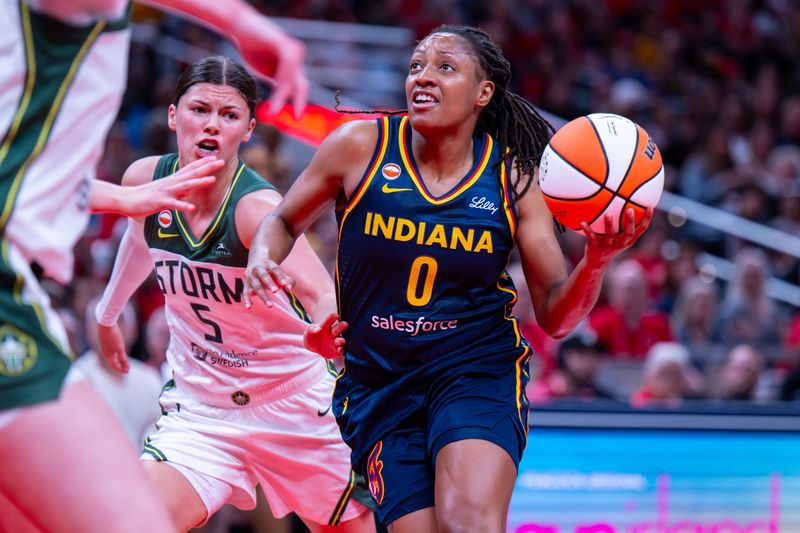 Indiana Fever guard Kelsey Mitchell (0) looks to shoot during the first half of an WNBA basketball game against the Seattle Storm, Sunday, May 17, 2026, at Gainbridge Fieldhouse.