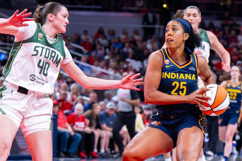 Indiana Fever forward Monique Billings (25) is stopped en route to the basket by Seattle Storm forward Grace Vanslooten (40) during the first half of an WNBA basketball game, Sunday, May 17, 2026, at Gainbridge Fieldhouse.