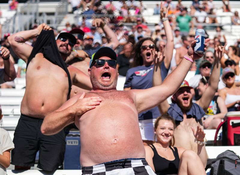 Racing fans cheer for A.J. Foyt Enterprises driver Santino Ferrucci (14) on Sunday, May 17, 2026, during qualifying for the 110th running of the Indianapolis 500 at Indianapolis Motor Speedway.