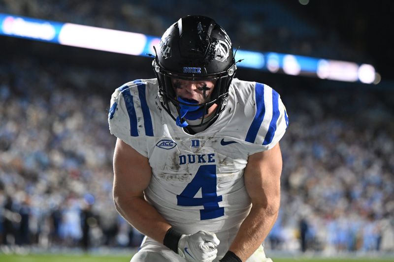 Nov 22, 2025; Chapel Hill, North Carolina, USA; Duke Blue Devils running back Anderson Castle (4) celebrates after a touchdown during the second half at Kenan Stadium. Mandatory Credit: William Howard-Imagn Images