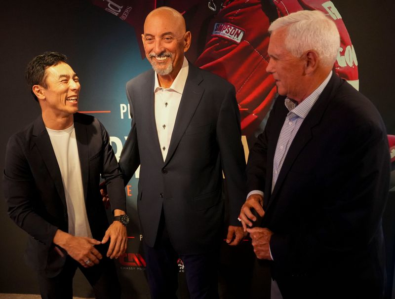 (From left) IndyCar driver Takuma Sato, Bobby Rahal and former Vice President Mike Pence talk on the red carpet before a screening for documentary “Bobby Rahal: True American Racer” on Tuesday, May 19, 2026, at Newfields in Indianapolis.