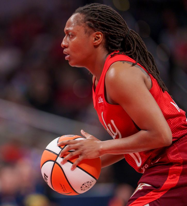 Indiana Fever guard Kelsey Mitchell (0) handles the ball as the Portland Fire face the Indiana Fever Wednesday, May 20, 2026, at the Gainbridge Fieldhouse in Indianapolis.
