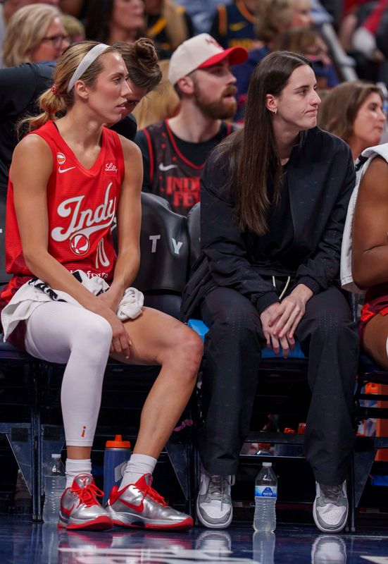 Indiana Fever guard Caitlin Clark (22) sits on the bench with Indiana Fever guard Lexie Hull (10) as the Portland Fire face the Indiana Fever Wednesday, May 20, 2026, at the Gainbridge Fieldhouse in Indianapolis.